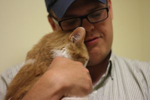 Man holding shelter cat