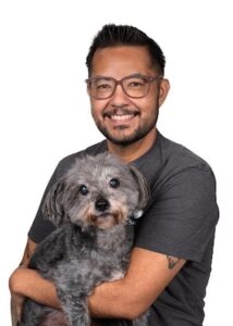 Miguel-Ruelas holding a dog