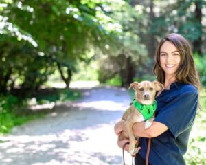 Bailey H Eagan, PhD, MSC, Director of Research, ASPCA, with small brown dog